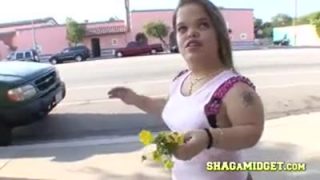 Mini chola picking up a tall black guy