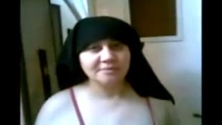 Fat mature fucks with her hijab on