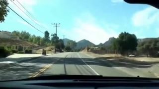 Giving a footjob in a car