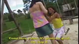 Two ladyboys bareback one another on the swing set